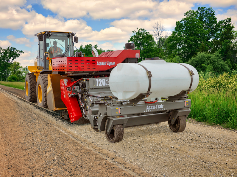 https://asphaltzipper.com/c/wp-content/uploads/2024/03/720Xi-WA-zipping-gravel-road.png