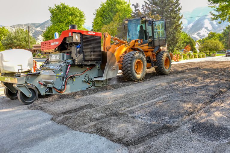 https://asphaltzipper.com/wp-content/uploads/sites/4/2023/11/full-width-road-DEH_9313-Edit-Edit-Edit-e1721932383940-768x512.jpeg