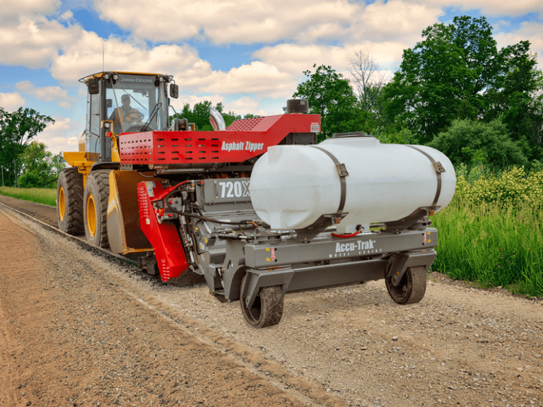 https://asphaltzipper.com/wp-content/uploads/sites/4/2024/03/720Xi-WA-zipping-gravel-road-768x576.png