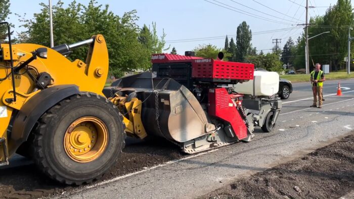 City of Renton, Washington uses portable road reclaimer attachment for asphalt patching on city streets.